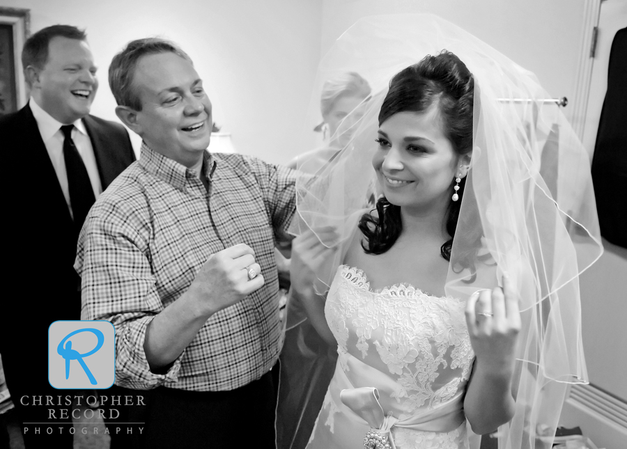 Michael looks on as Penn assists Jackie with her veil