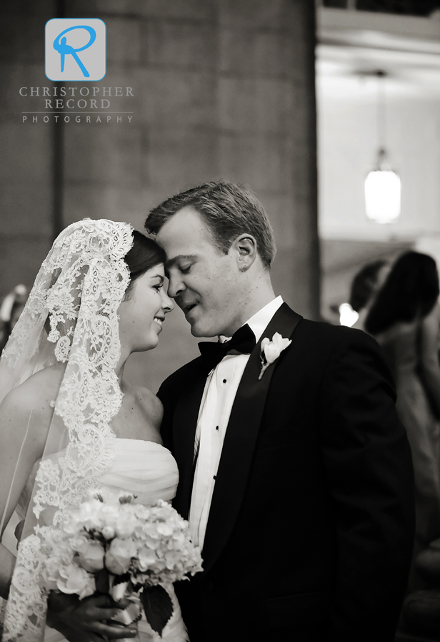 Lucy and James pause following their wedding ceremony