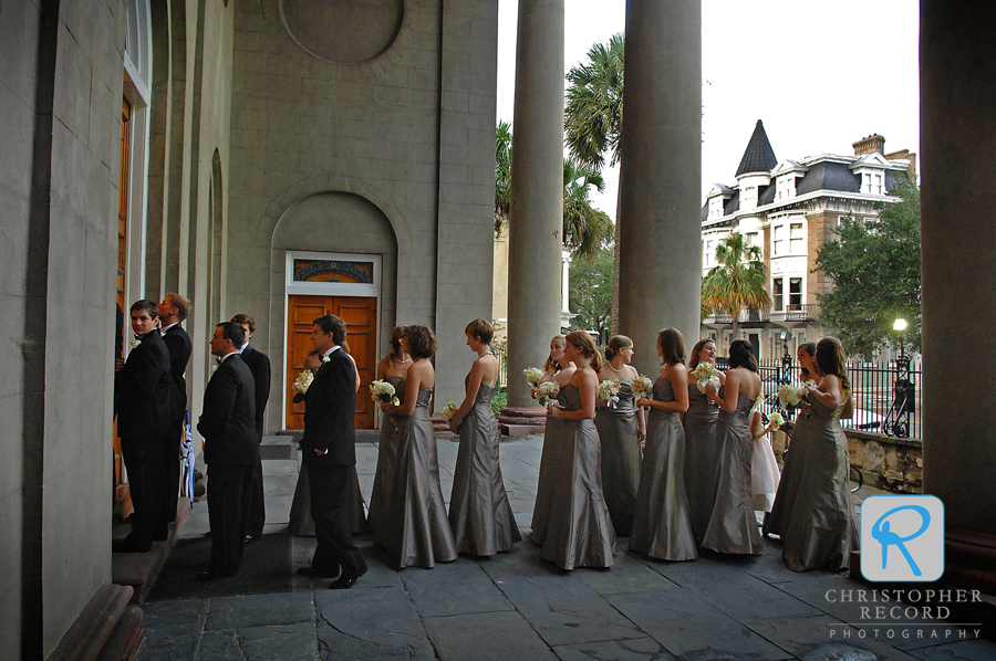 The bridal party enters the church