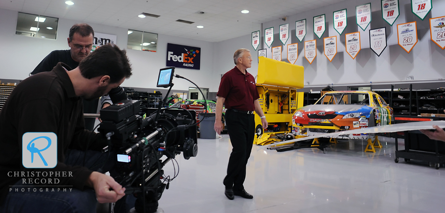 Gibbs, whose teams has won 3 Cup Series chamionships, is filmed walking through his shop