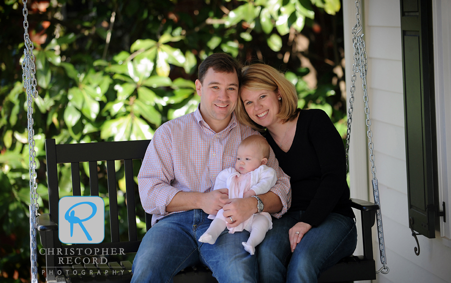 Mike, Laura and Anna on their porch swing