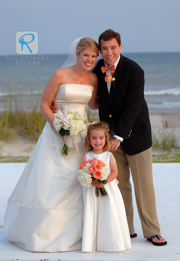 Laura and Mike with their flower girl at The Coral Bay Club at Atlantic Beach