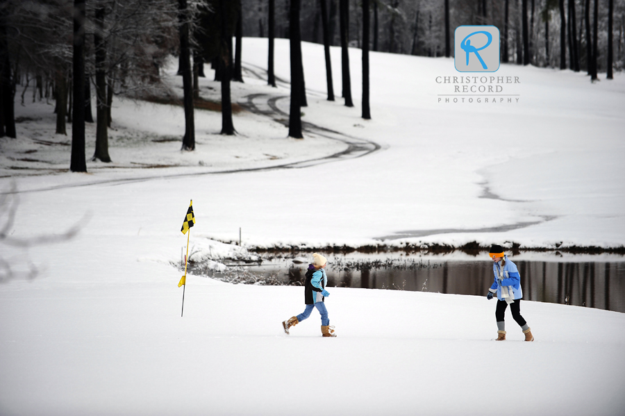 Kids on one of the golf greens at Highland Creek