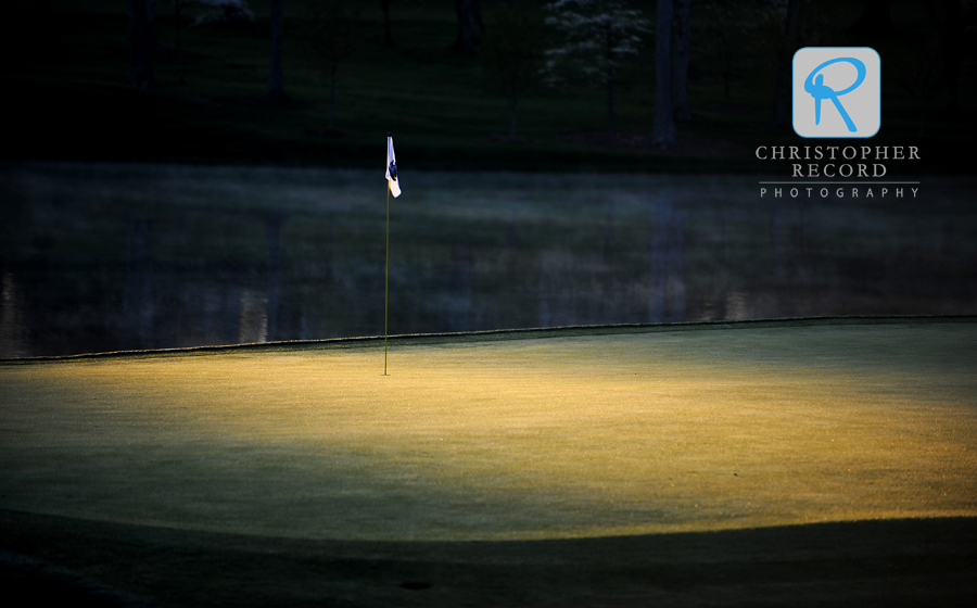 Pretty light illuminates the pin on the 17th green