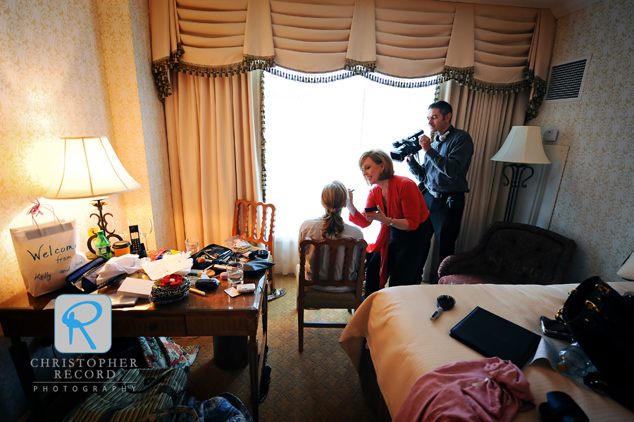 Carolyn applies Kelly's makeup as Alan Daly of Crown Alley Films records the scene