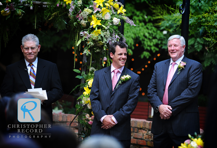 Benny and his stepfather and best man Barry take their positions