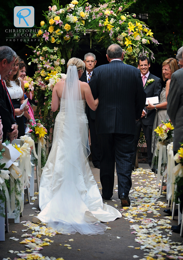 Benny watches Kelly walk down the aisle with her father 