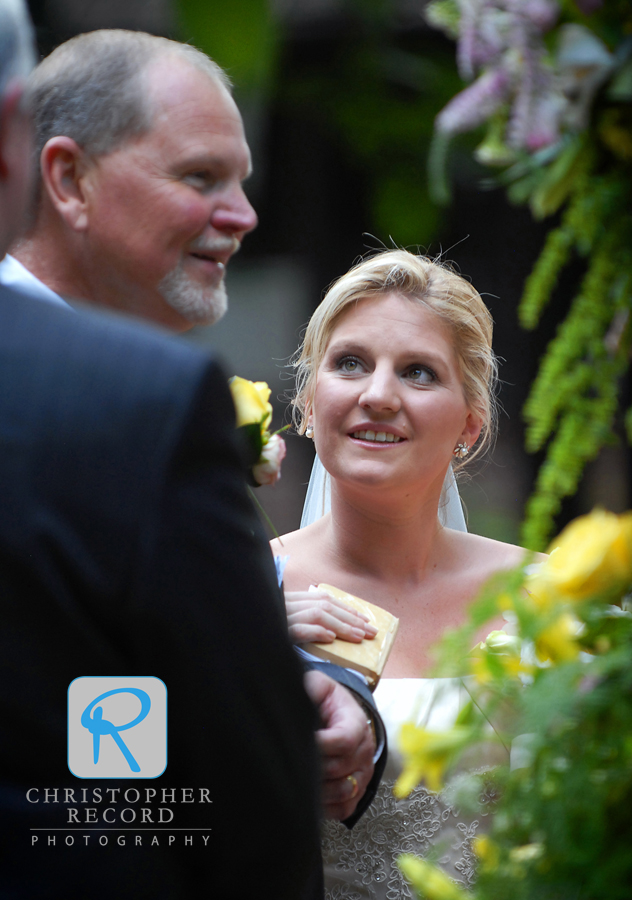 Kelly looks at her father Larry as he prepares to give her away