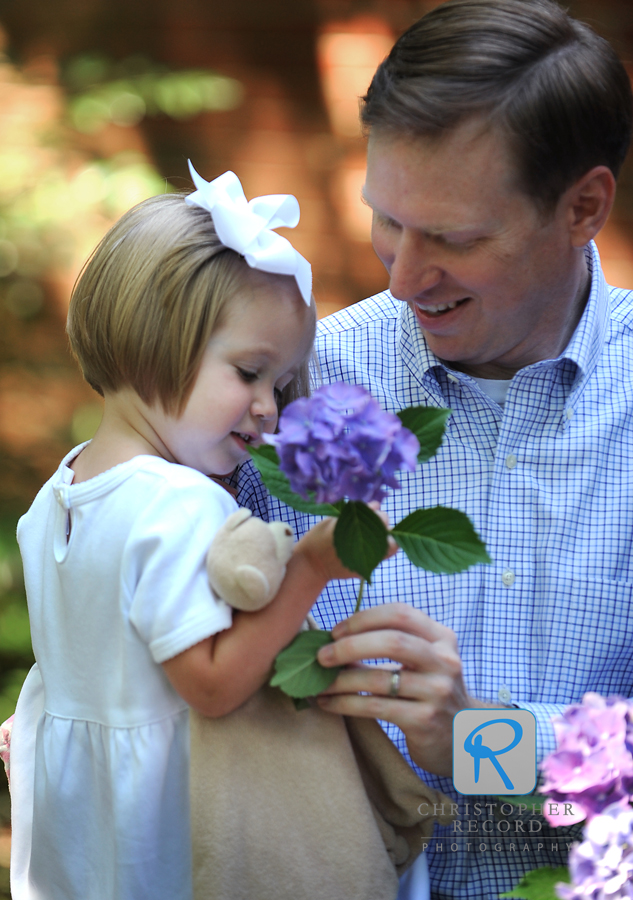 Callan and Lilly check some of the pretty flowers in their yard