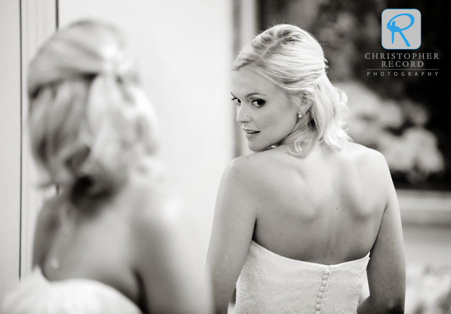 Katie checks her dress while getting ready at Myers Park Presbyterian Church