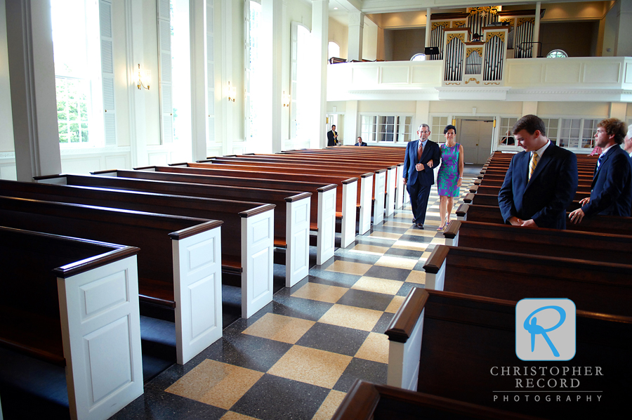 Monette's brother Paul walks her down the aisle during rehearsal at Christ Episcopal Church
