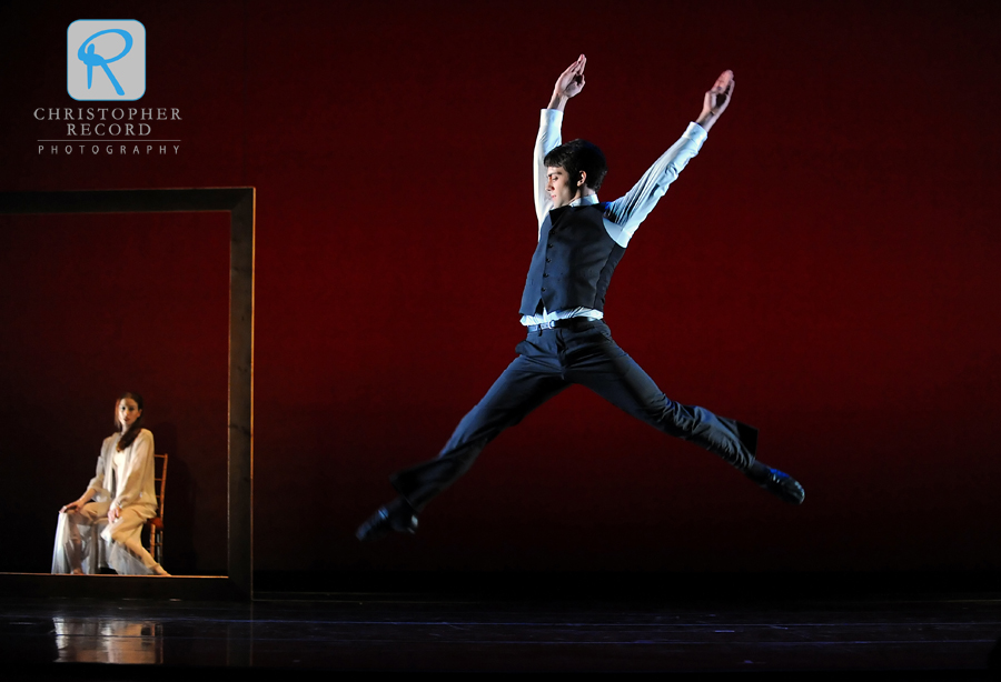 Dustin Layton leaps as Traci Gilchrest is framed onstage