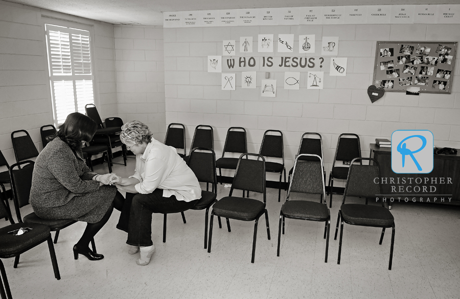 The Rev. Beth McConnell, a friend who performed the ceremony, prays with Barbara before the wedding