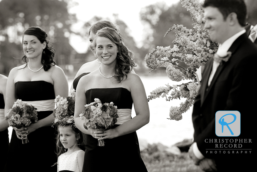 Watching as the bride walks down the aisle