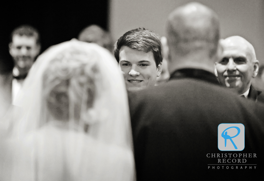 Michael watches his bride approach the alter