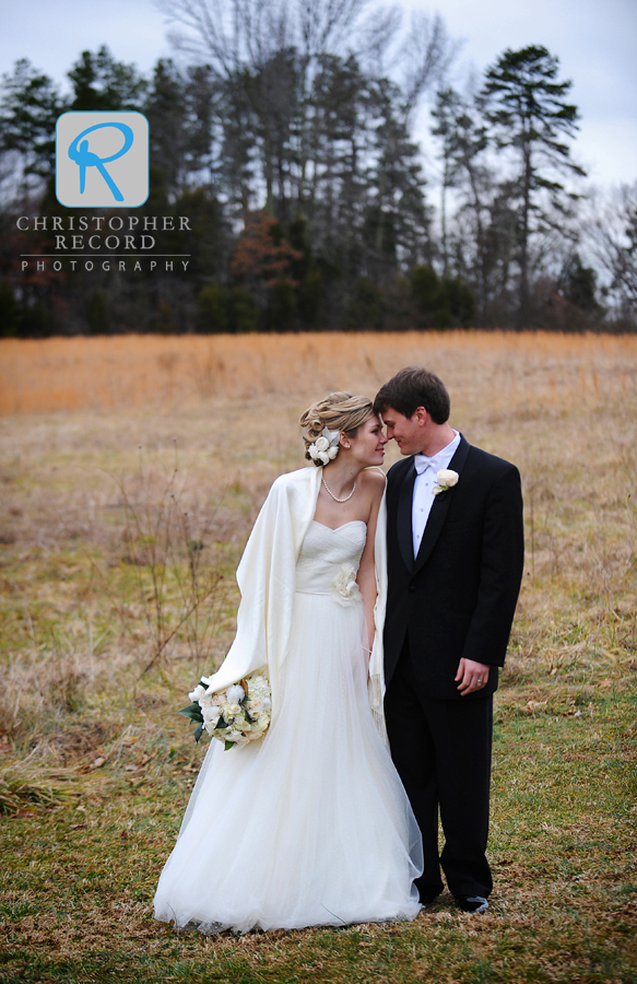 Liz and Michael cuddle up as they get ready for their portraits