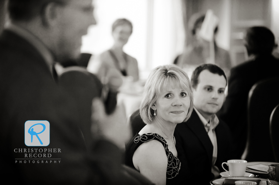 Brad and his mother Janice listen as his father Bob speaks