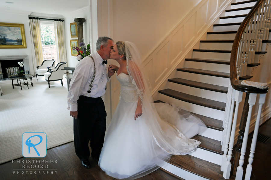 Father David greets Elizabeth with a kiss