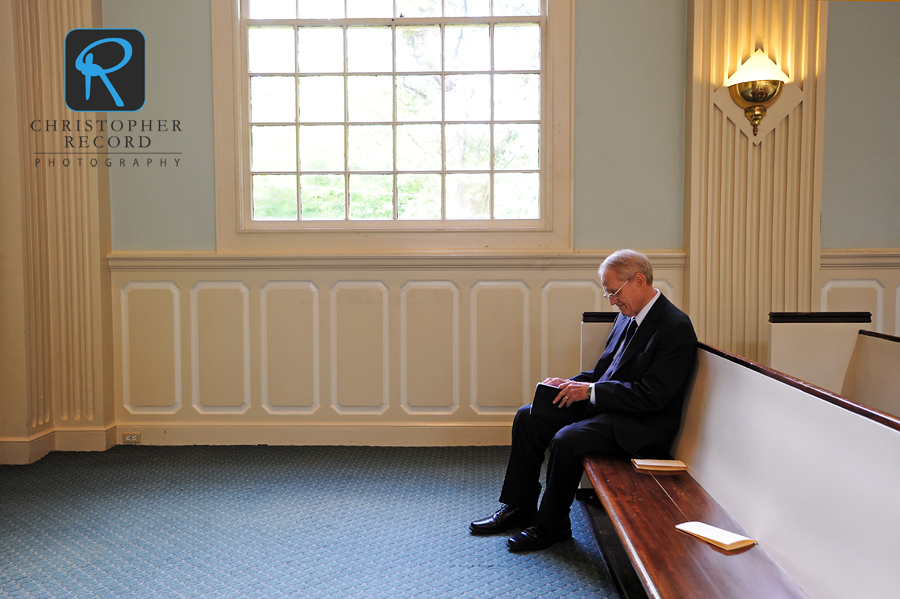 Elizabeth's grandfather Denny, who performed the service, prepares