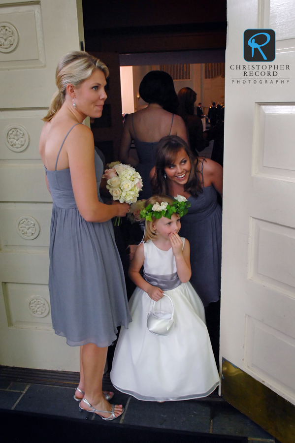 Brad's sister Katie, left, Elizabeth's sister Denard and flower girl Kendall had to check the bride too