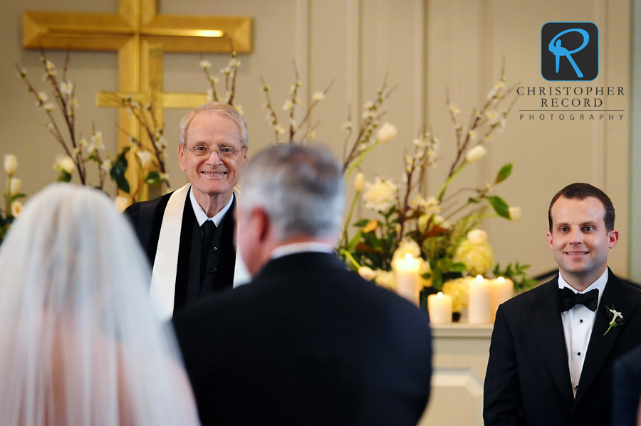 Elizabeth's minister grandfather and Brad watch her entrance