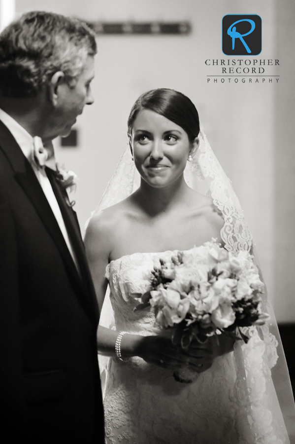 Tanner and her father talk as they prepare to walk down the aisle