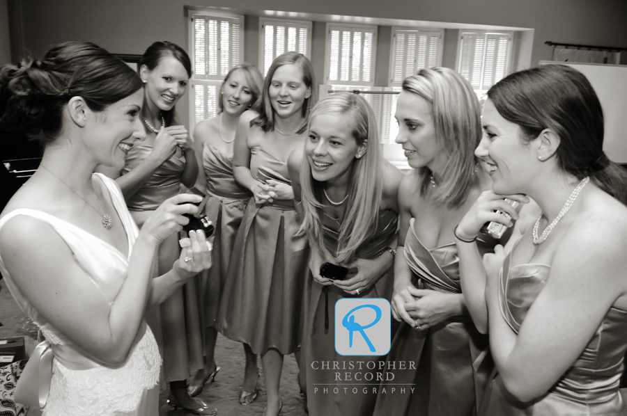 Ann shows her new earrings to her bridesmaids