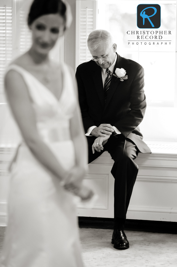 Hart checks his watch as the readies to walk Ann down the aisle