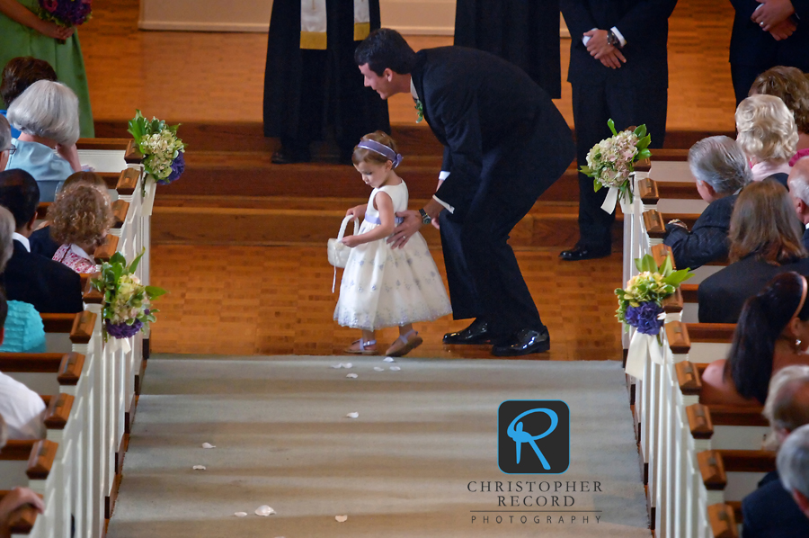 Ann's brother, a groomsman, points his daughter in the right direction