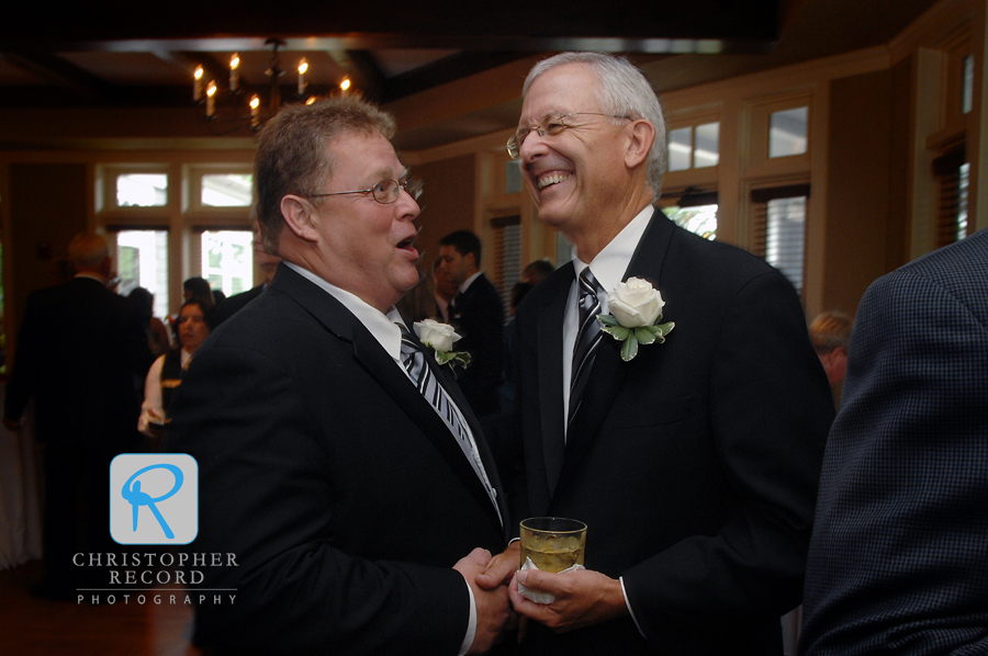 The fathers, Johnny and Hart, share a laugh at the cocktail hour