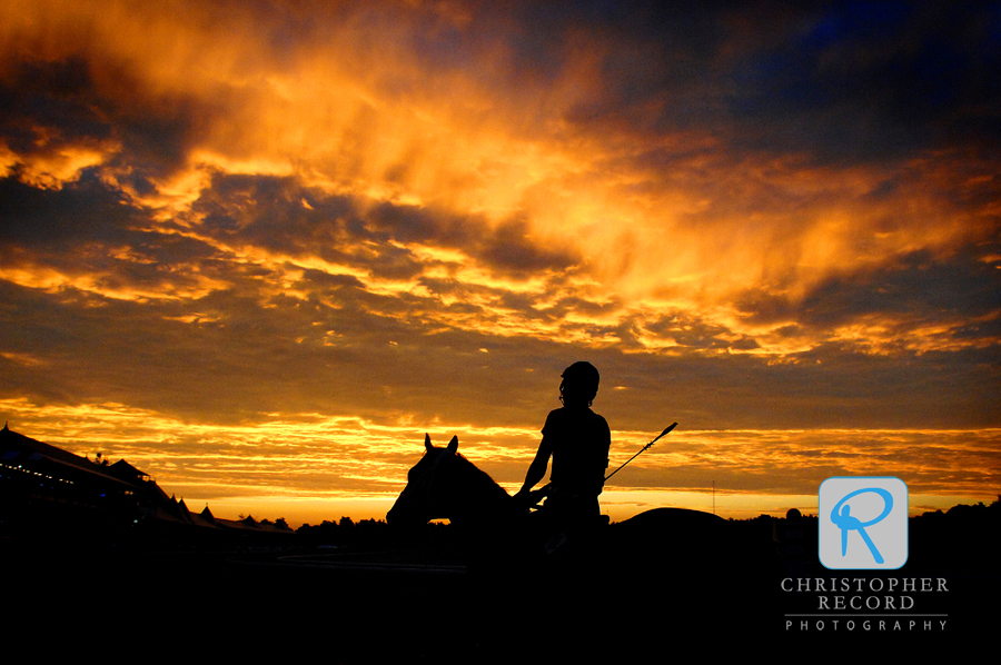 An amazing sky greets riders breezing the race horses