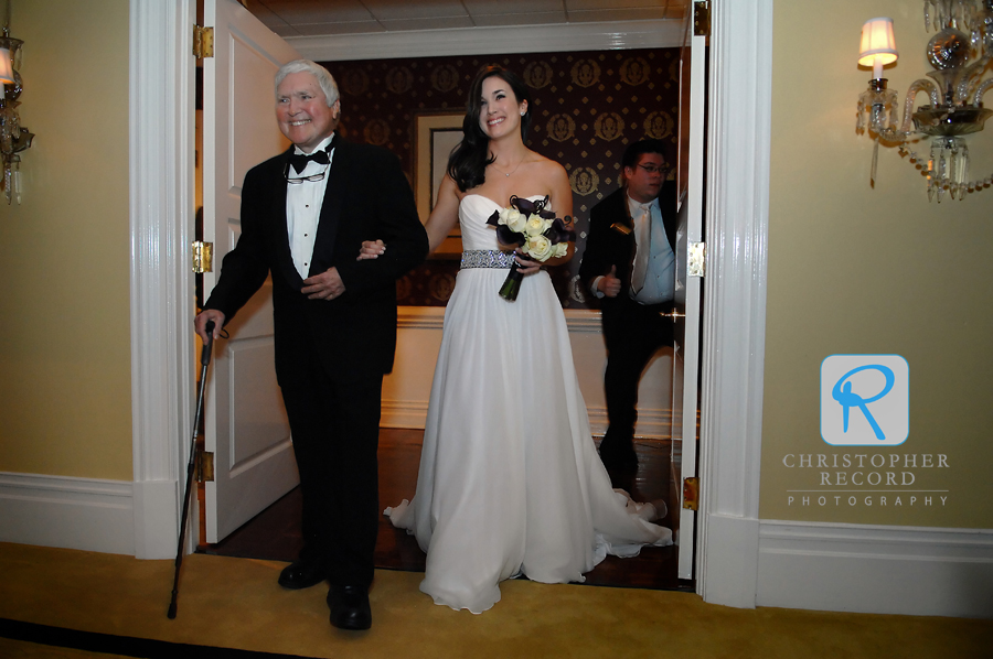 Leighton's father escorts her to the ceremony