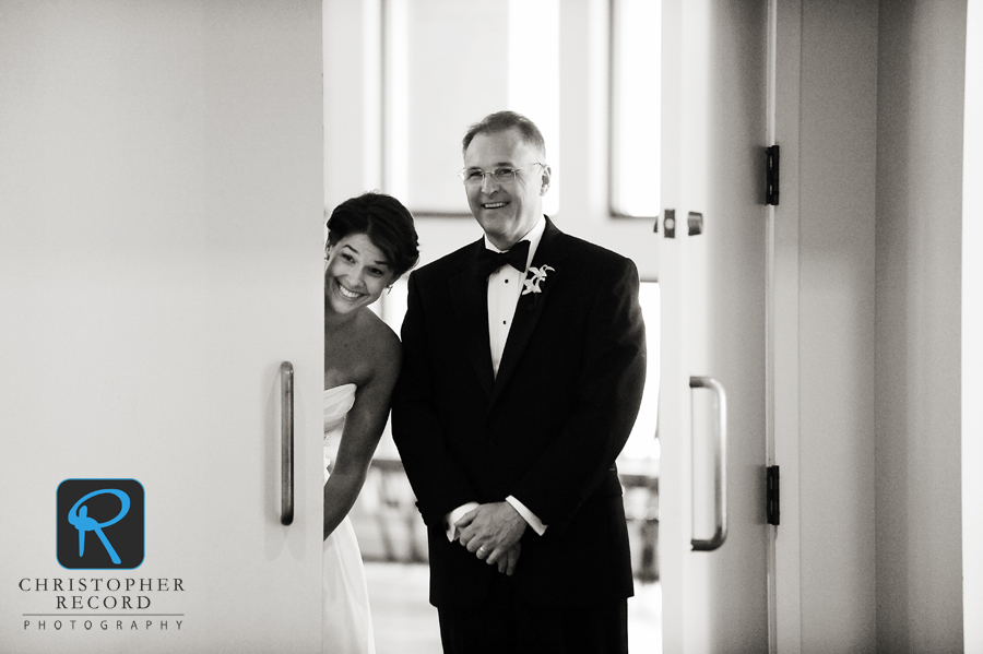 Amy and her father watch the activity as they wait for their entrance