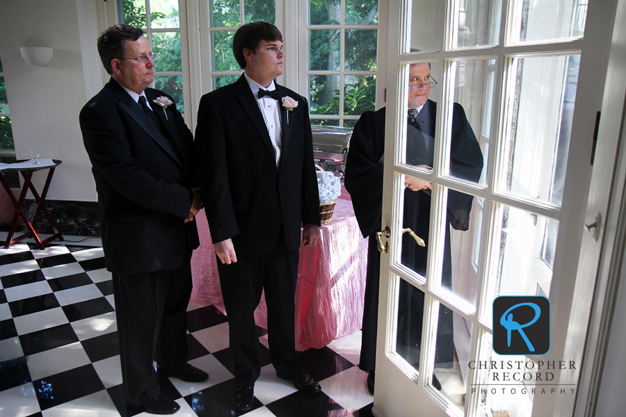 Clay, his father and the minister wait for their entrance