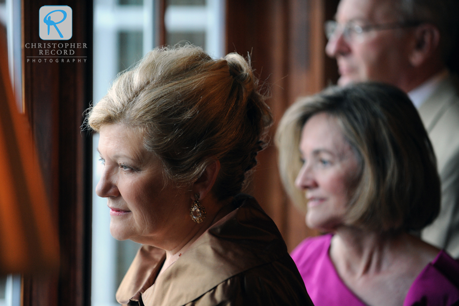 Ellen's parents and Scott's mother watch the guests arrive