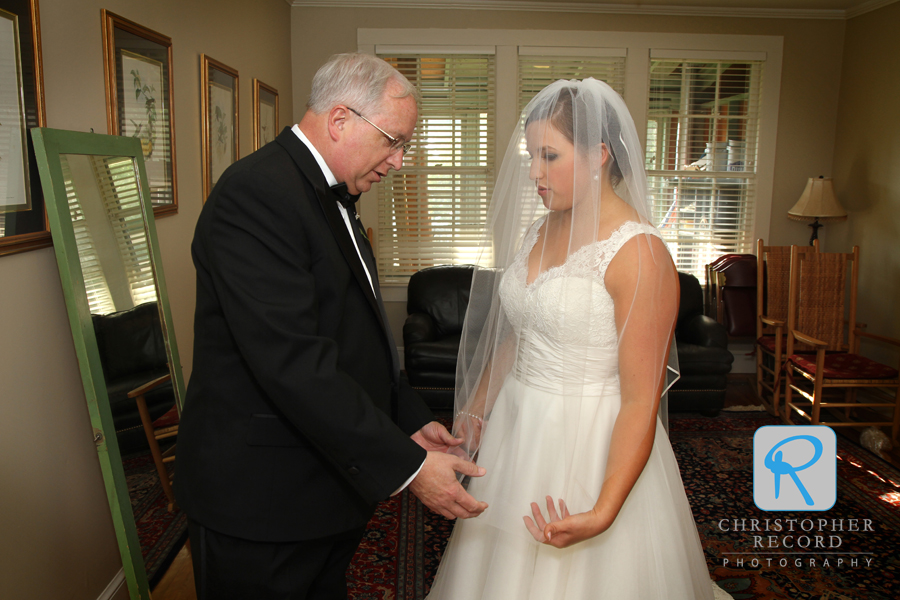 Christina and her father go over the ceremony details