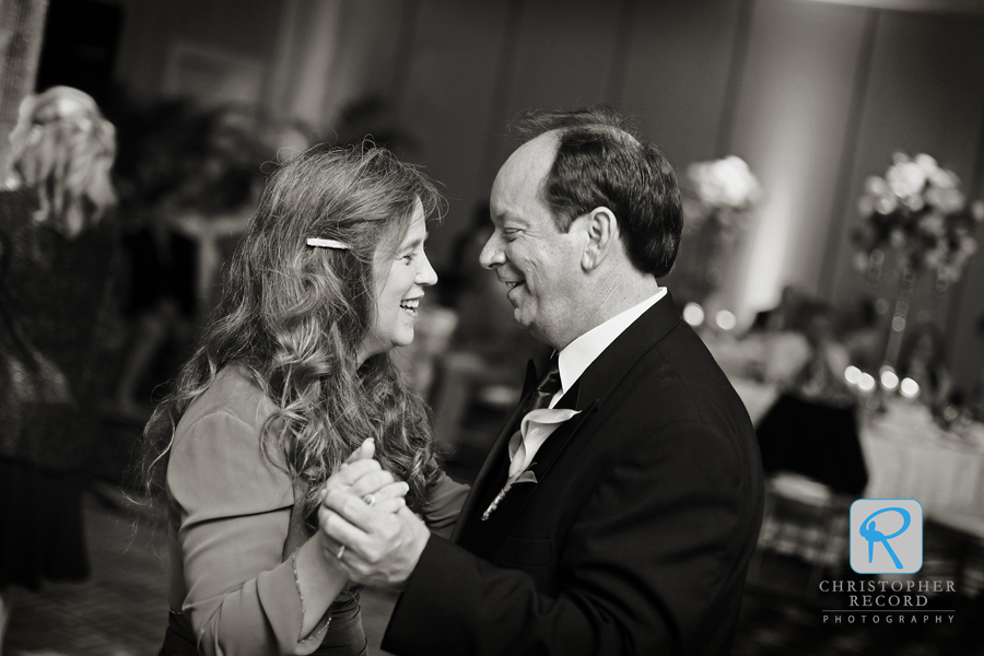 The bride's parents enjoy the party