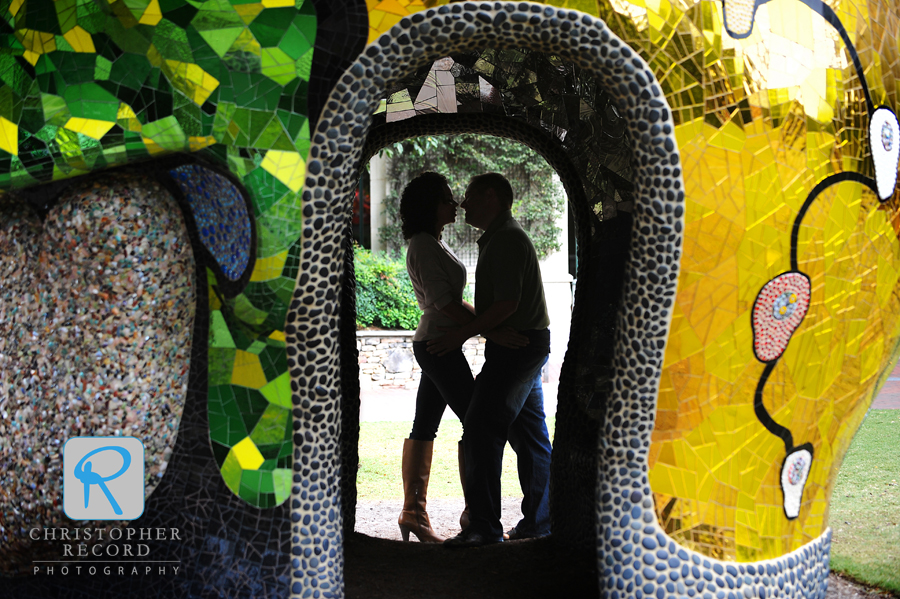 Melissa and Dan framed by a Niki de Saint Phalle sculpture in Charlotte