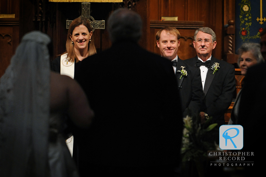 Patrick watches his bride enter as the Rev. Katherine Kerr and his father look on