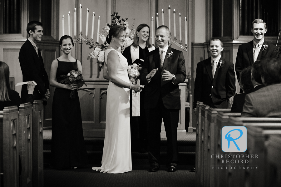 Gretchen and Mark and their children, from left, Alec, Gracie, Luke and Russ follow the Rev. Katherine Kerr's invitation to greet their guests during the service 