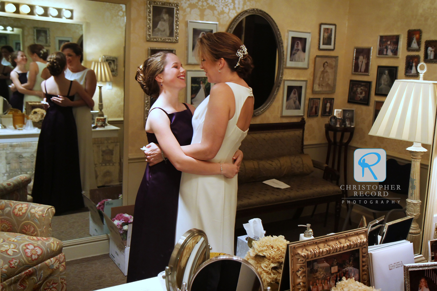 Mother and daughter laugh as they prepare for a big life change