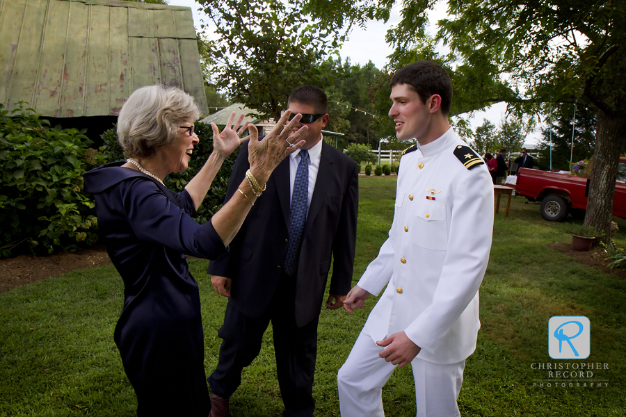 Mary Ellen's aunt, who hosted the event, greets William before the service