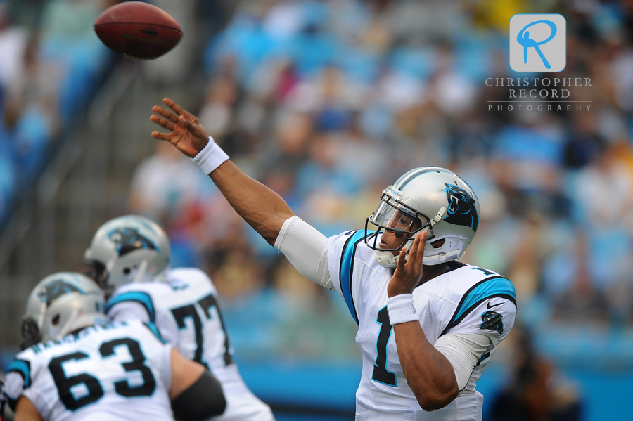 Cam Newton fires a pass