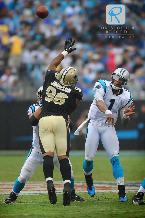 Cam Newton fires a pass