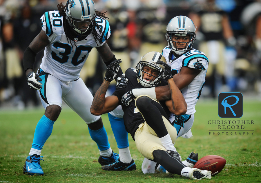 Panther cornerback Josh Norman puts a hit on a Saint receiver