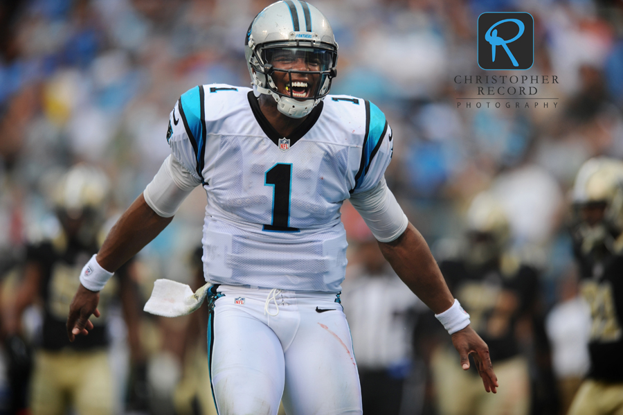 Quarterback Cam Newton celebrates a Carolina touchdown