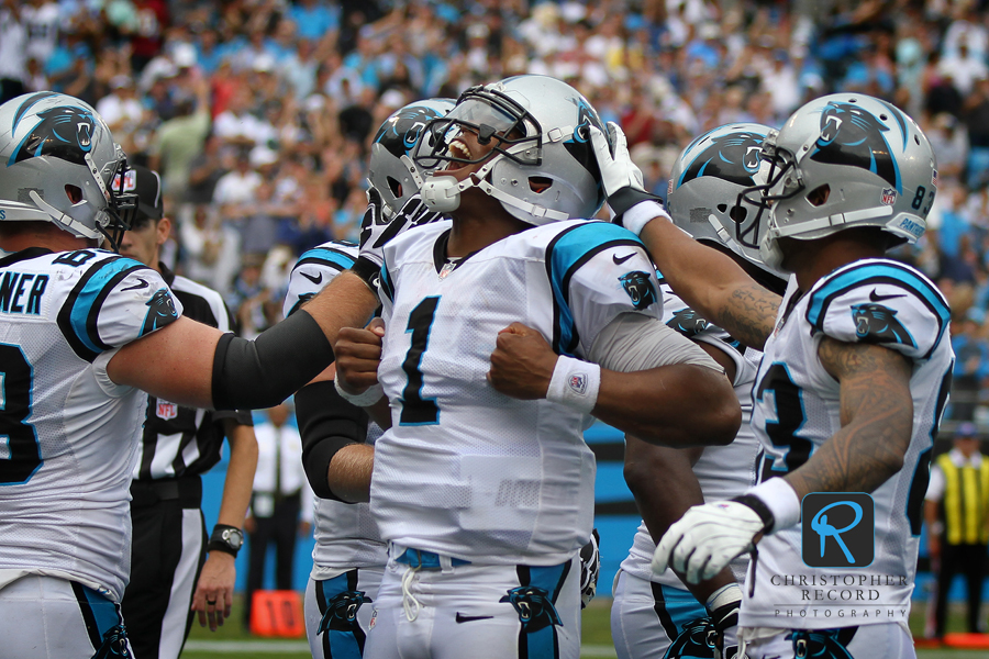 "Superman" emerges as Cam Newton scores a late touchdown