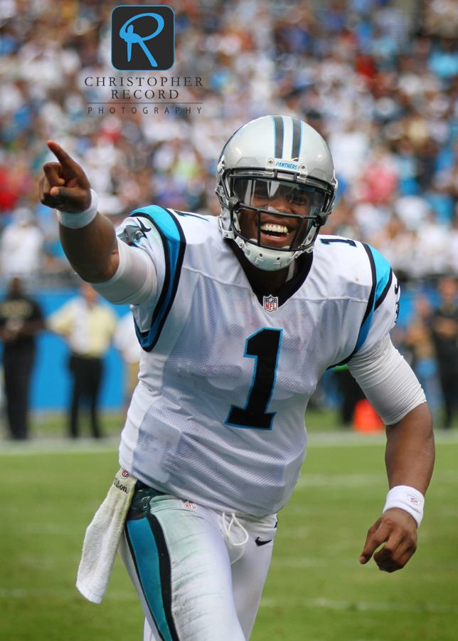 Cam Newton celebrates with the fans