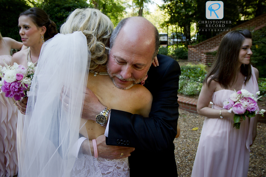 A big hug from her father