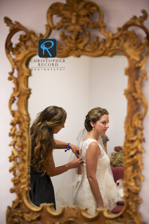 Maid of honor Amy helps her sister get ready